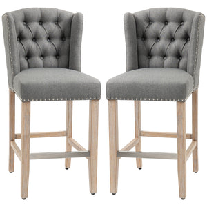 Set of 2 upholstered bar stools with studded back and footrest, gray