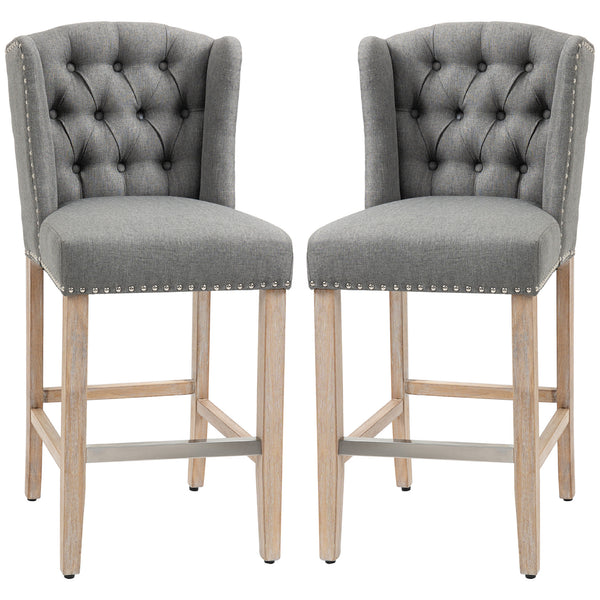 Set of 2 upholstered bar stools with studded back and footrest, gray