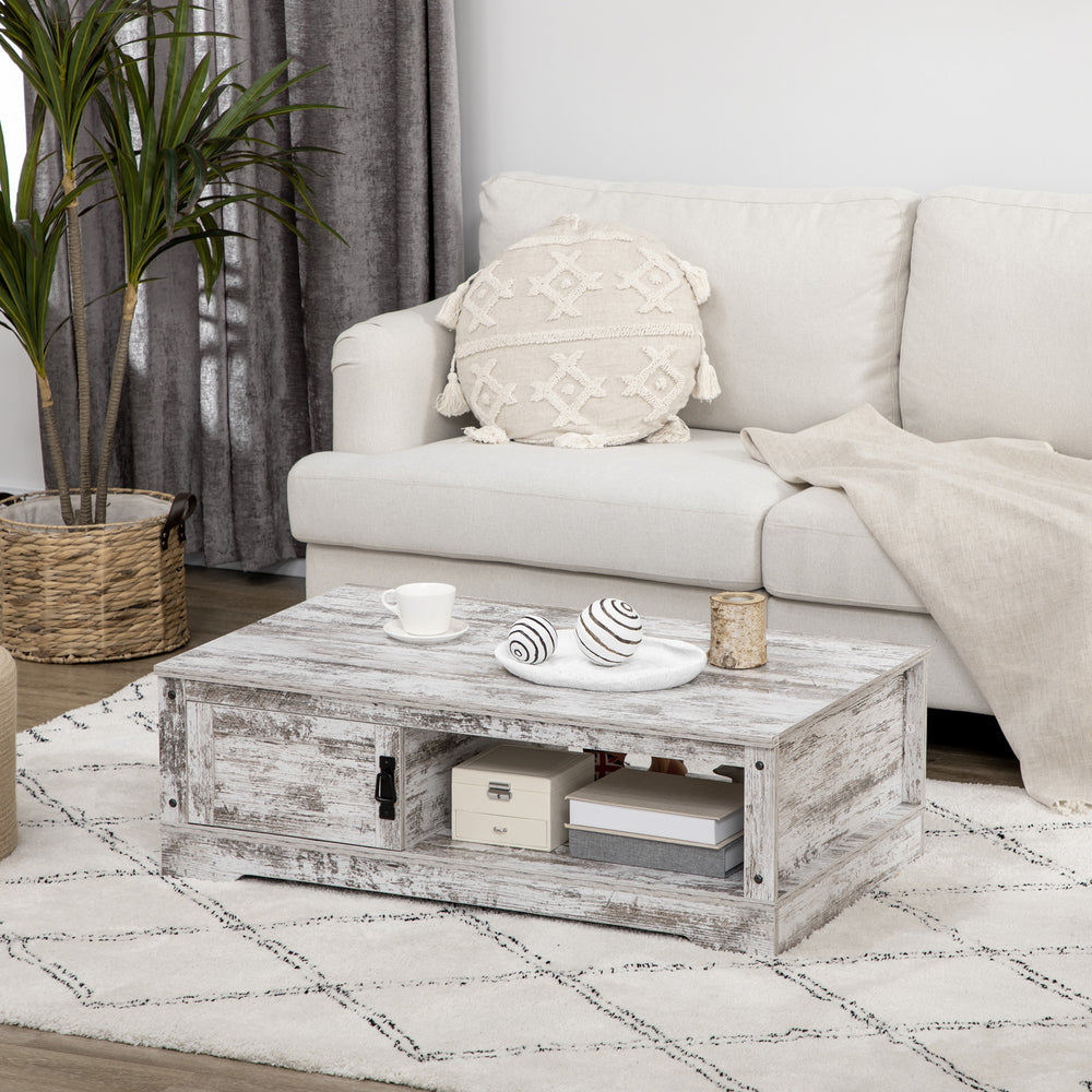 Table basse vintage blanche avec rangement fermé type armoire et compartiments ouverts, idéale pour un salon au style classique ou rétro