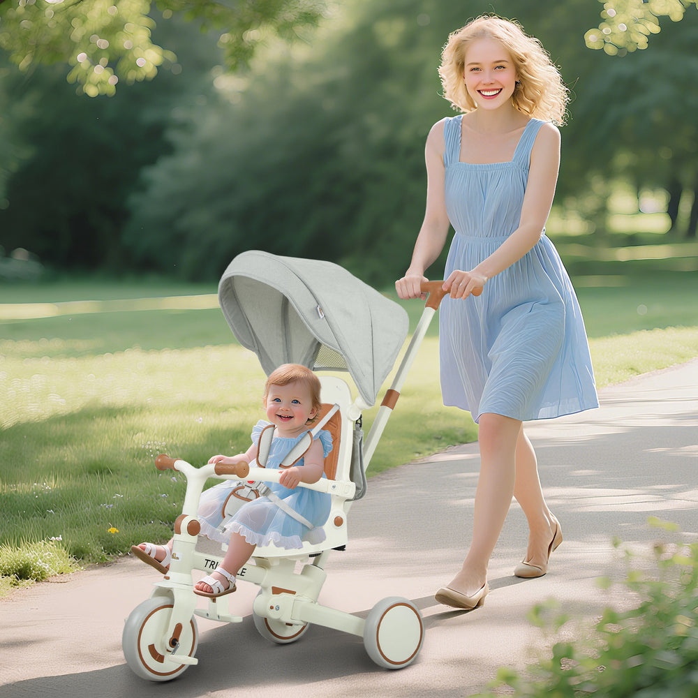 Tricycle 7 en 1 avec harnais de sécurité, poignée parentale réglable et amovible, blanc crème