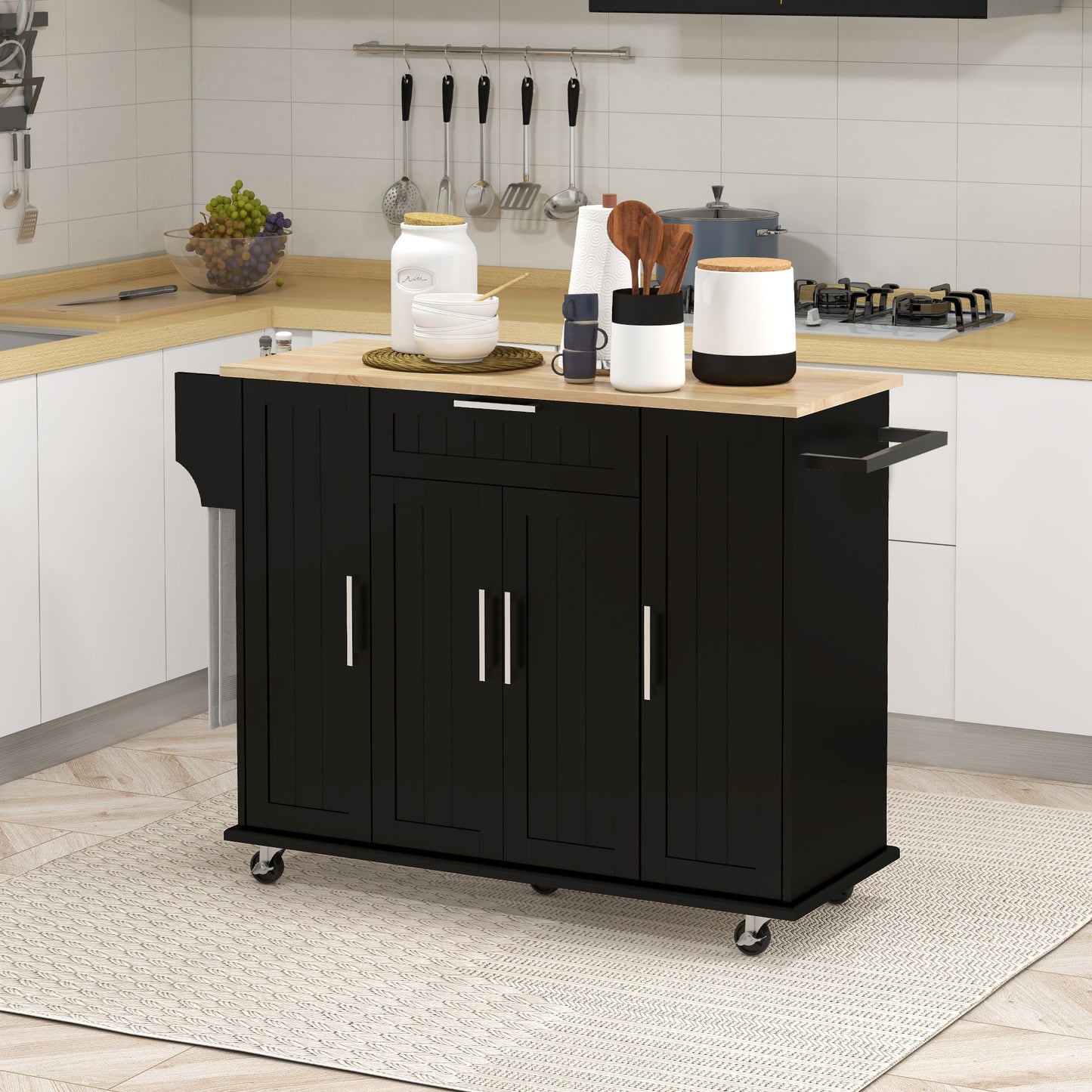 Desserte de cuisine moderne noire avec roulettes, tiroirs de rangement, plateau en bois naturel et porte-serviettes intégré, idéale pour optimiser l’espace dans une cuisine contemporaine