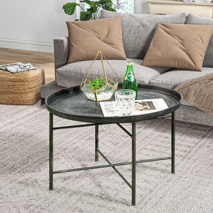Table basse vintage ronde avec plateau martelé et structure en métal, couleur étain