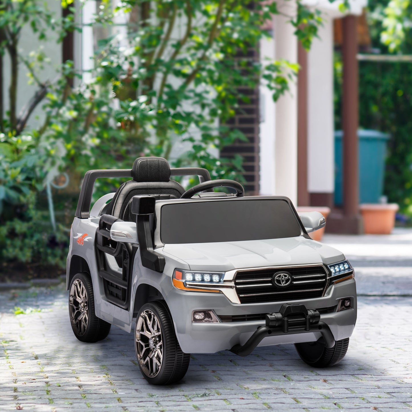 Voiture électrique 12 V Toyota Land Cruiser sous licence pour enfants, avec télécommande parentale, suspension à ressorts aux quatre roues, démarrage progressif et éclairage LED, couleur gris