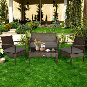 Set of 4 upholstered rattan patio furniture pieces - brown