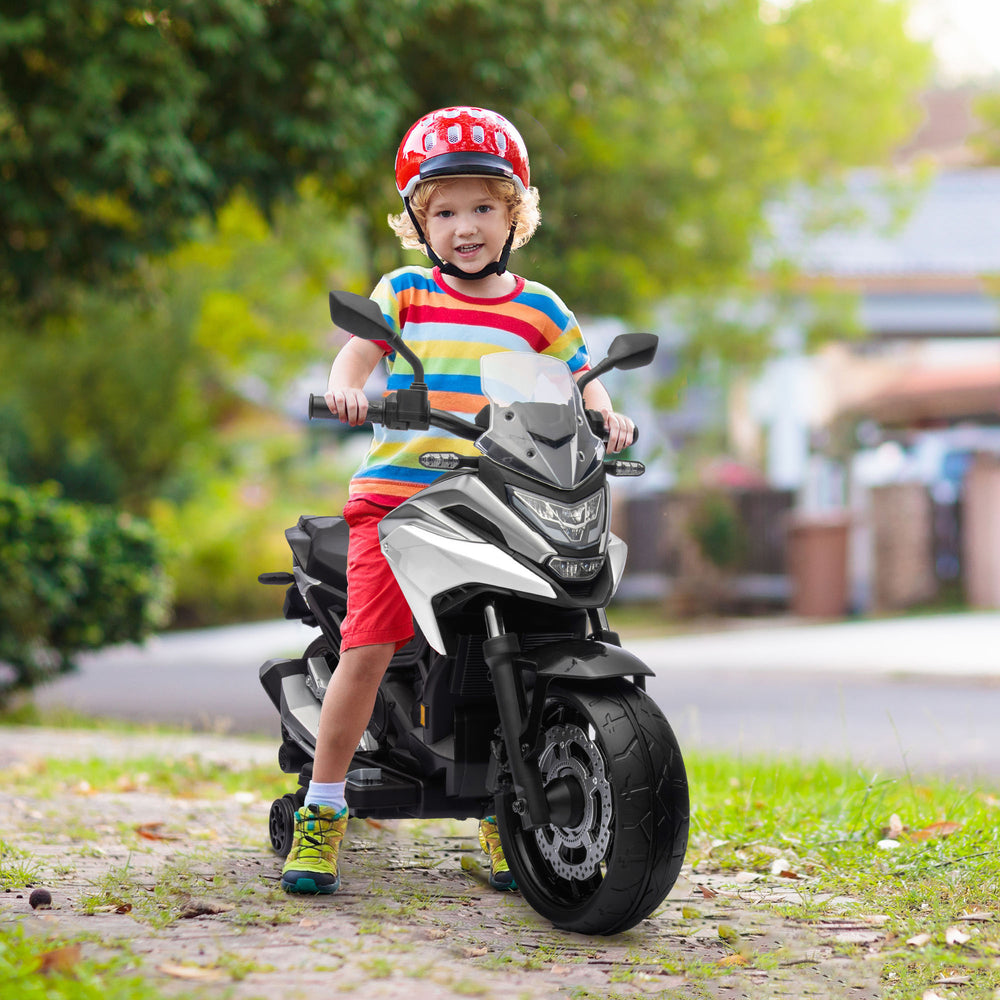 Honda 12V motorcycle with headlights and training wheels, white