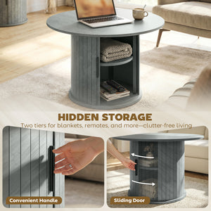 Table basse ronde avec base cannelée et rangement caché à porte coulissante – Gris ciment