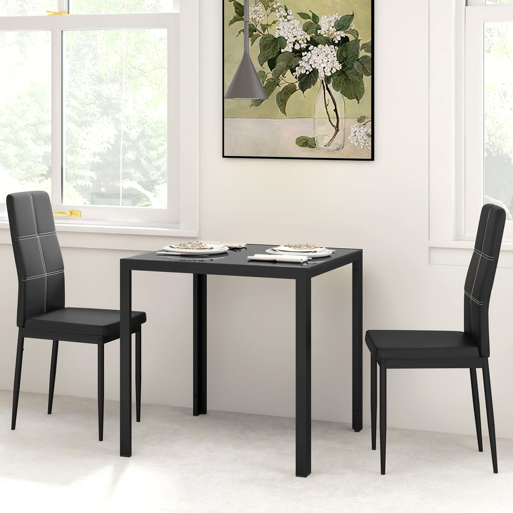 Ensemble de tables et chaises en verre avec structure en métal et revêtement en similicuir pour salle à manger, noir