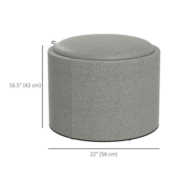 Table basse ronde avec rangement dissimulé et plateau rembourré en lin gris