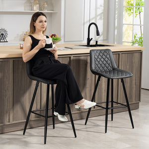 Set of 2 black faux leather bar stools.