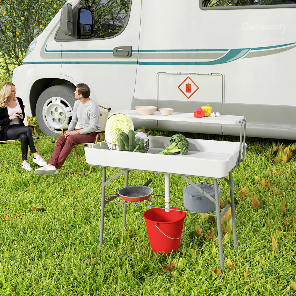 Table glacière pliante avec système d'évacuation