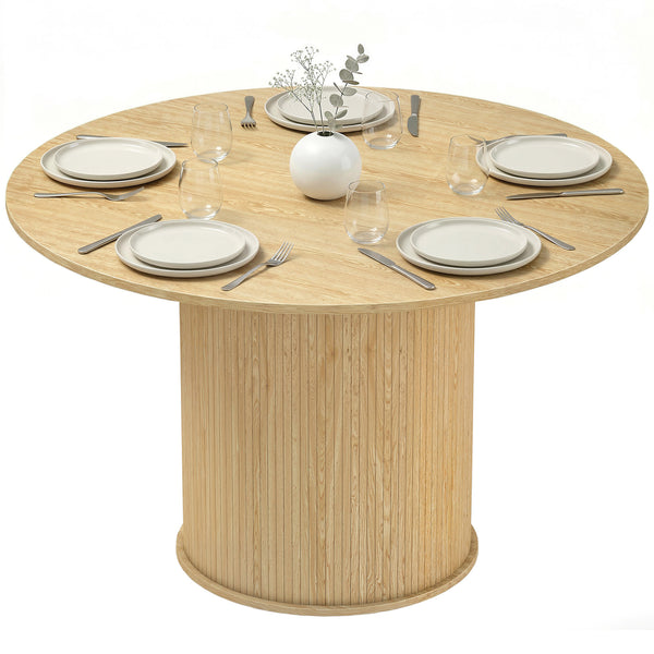 Table de salle à manger ronde pour 5 personnes avec pied central cannelé, couleur naturelle.