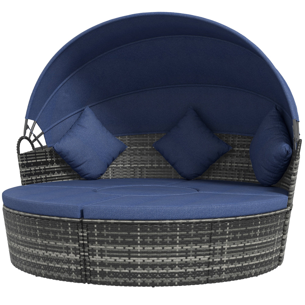 Méridienne d’extérieur 4 pièces avec coussins bleu foncé et auvent rétractable, idéale pour se détendre au soleil ou à l’ombre sur une terrasse ou près de la piscine