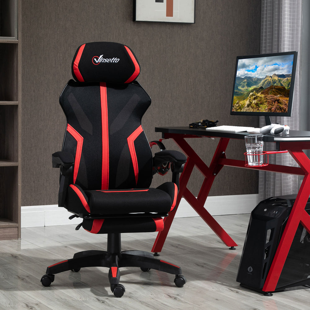 Fauteuil de gaming ergonomique avec repose-pieds, noir et rouge.