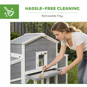 Wooden chicken coop with 2 nesting boxes, a pull-out tray, and a ramp