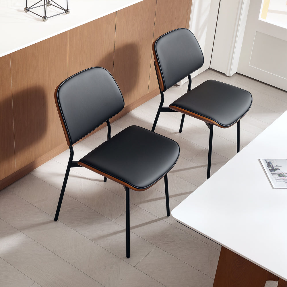 Set of 2 mid-century modern chairs with curved wooden backs and metal legs