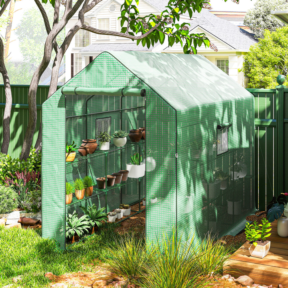 Three-tier garden greenhouse with roll-up door and screened windows, green