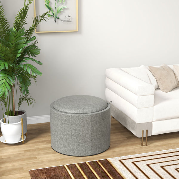 Table basse ronde avec rangement dissimulé et plateau rembourré en lin gris