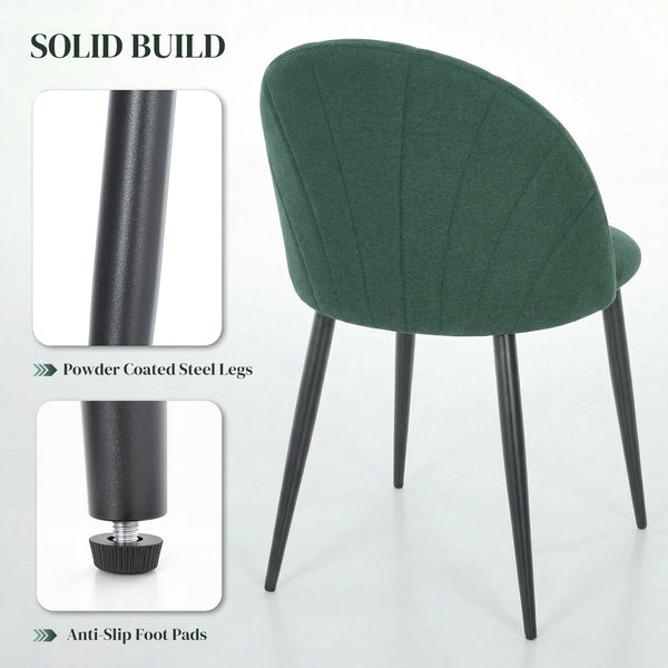 Set of 4 modern dining chairs with metal legs, shell back, and upholstered seat, green.