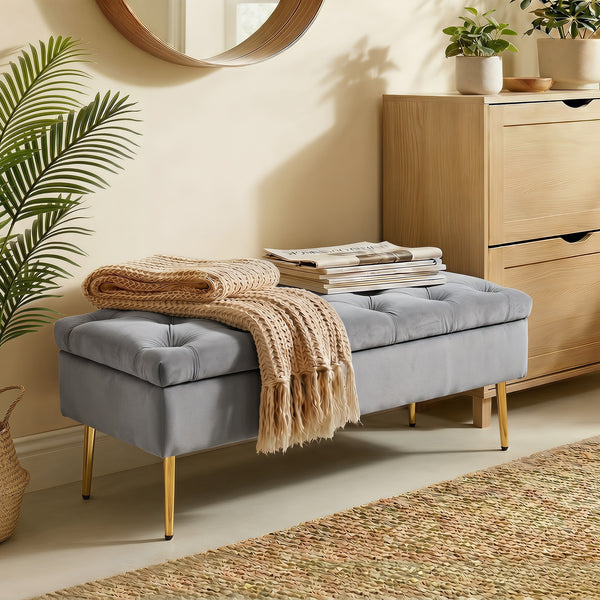Banc ottoman avec rangement, assise capitonnée en velours et pieds dorés – Gris et doré