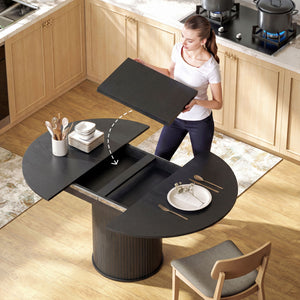 Table de cuisine extensible pour 6 à 8 personnes, style ferme, avec pied central et finition bois noir.