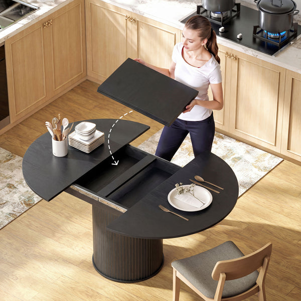 Table de cuisine extensible pour 6 à 8 personnes, style ferme, avec pied central et finition bois noir.