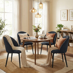 Set of 4 modern dining chairs with metal legs, shell back, and upholstered seat, black.