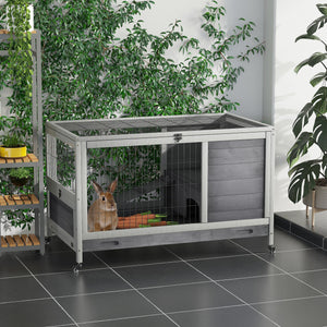 Indoor wooden hutch with enclosed run and wheels