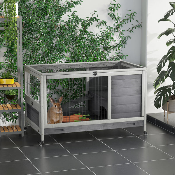 Indoor wooden hutch with enclosed run and wheels