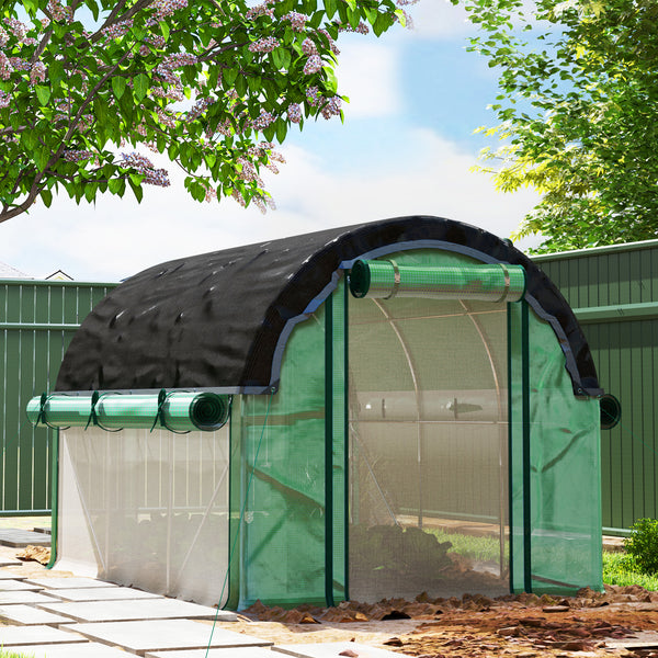 Heated tunnel greenhouse for plants with shade netting and roll-up mesh side walls