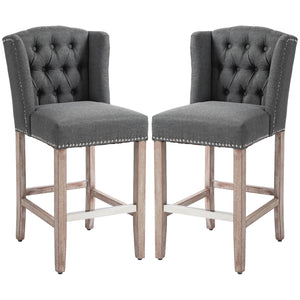 Set of 2 upholstered bar stools with studded backrest and footrest, dark grey