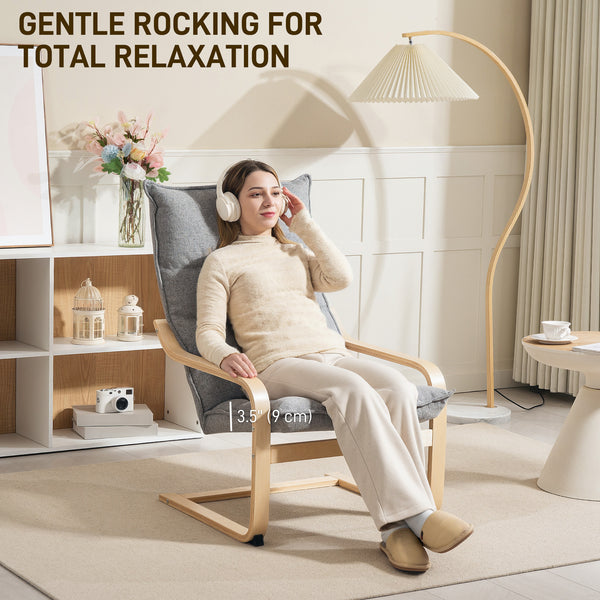 Fauteuil moderne rembourré avec pieds et accoudoirs incurvés, gris clair