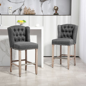 Set of 2 upholstered bar stools with studded backrest and footrest, dark grey