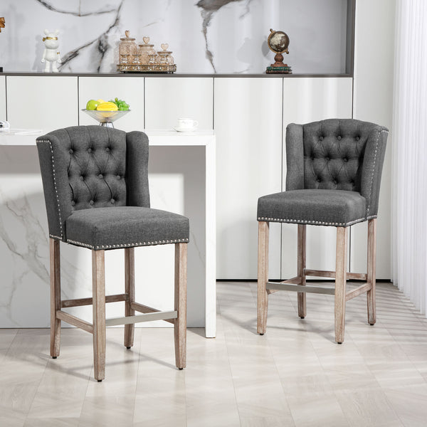 Set of 2 upholstered bar stools with studded backrest and footrest, dark grey