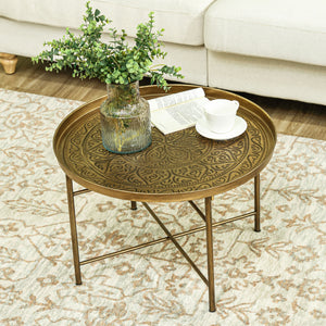 Vintage round coffee table with hammered top and metal frame, gold