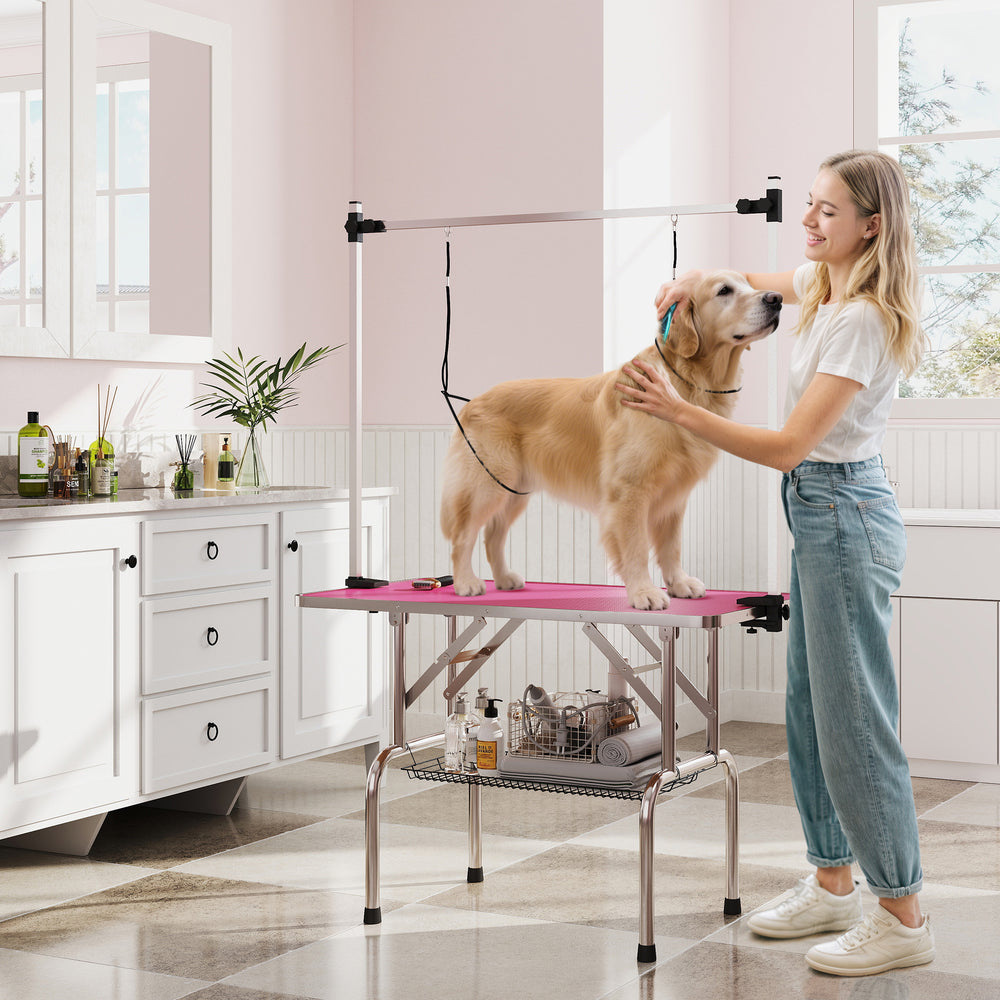Table de toilettage réglable pour chiens avec 2 sangles de sécurité et panier de rangement, rose