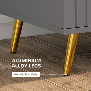 Commode à 3 tiroirs avec pieds en aluminium et poignées dorées, gris foncé.