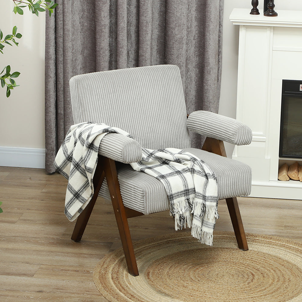 Fauteuil d'appoint en velours côtelé avec assise large et accoudoirs rembourrés, gris clair