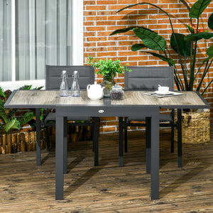 Extendable dining table with aluminum frame and plastic top, beige