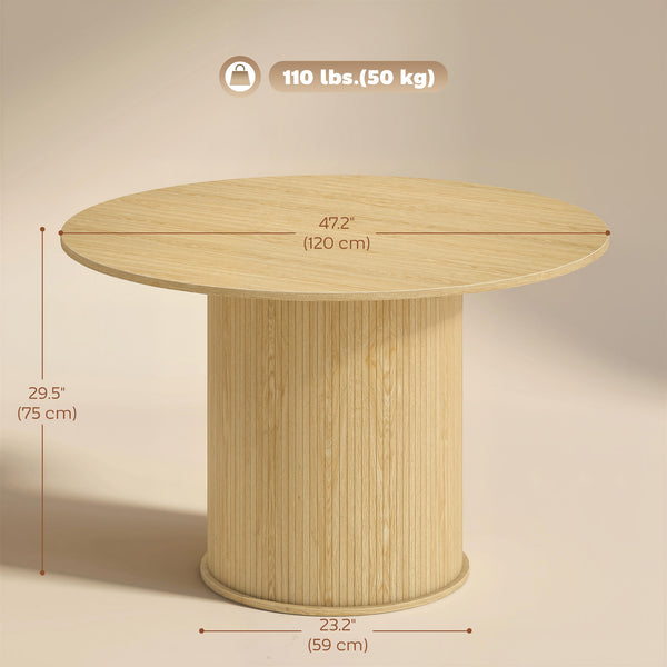 Table de salle à manger ronde pour 5 personnes avec pied central cannelé, couleur naturelle.