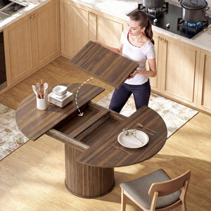 Table de cuisine extensiblepour 6 à 8 personnes style ferme, avec pied central et finition noyer.