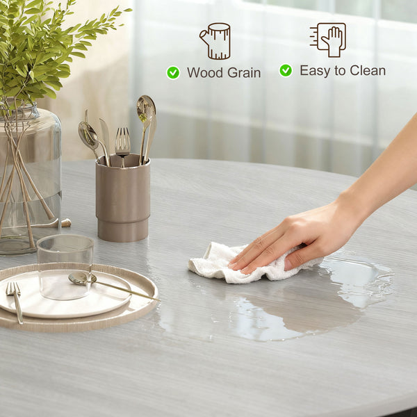 Modern round dining table with steel frame, grey