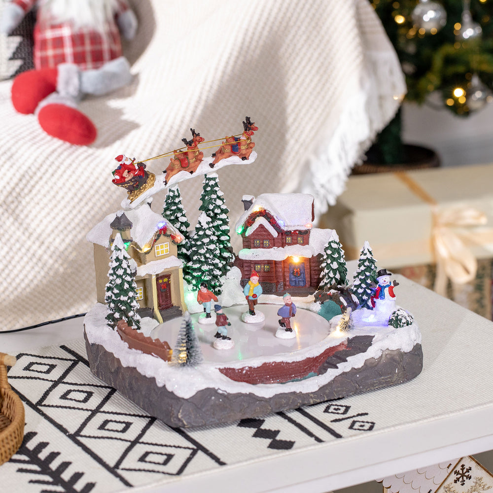 Village de Noël avec étang de patinage du Père Noël animé avec lumière LED multicolore