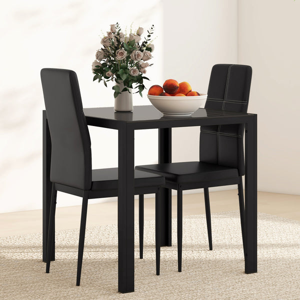 Ensemble de tables et chaises en verre avec structure en métal et revêtement en similicuir pour salle à manger, noir