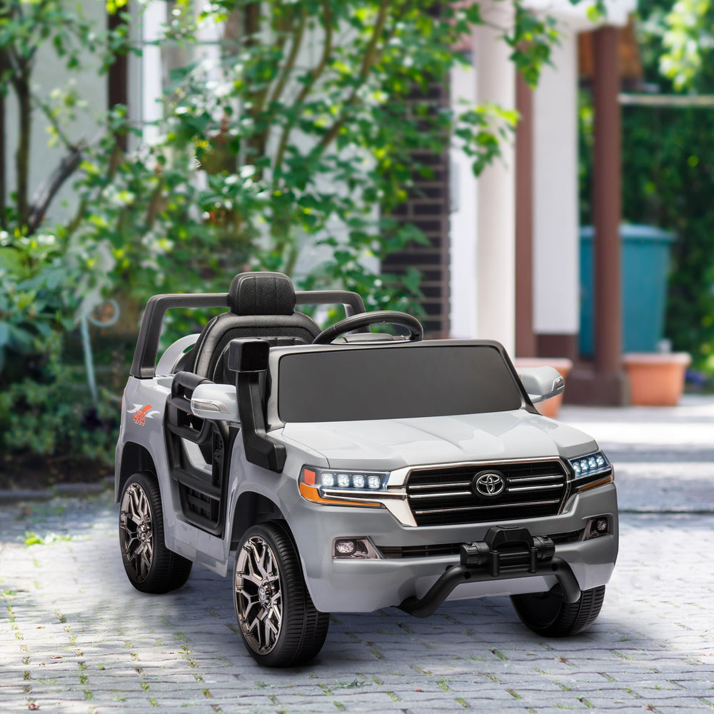 Voiture électrique 12 V Toyota Land Cruiser sous licence pour enfants, avec télécommande parentale, suspension à ressorts aux quatre roues, démarrage progressif et éclairage LED, couleur gris