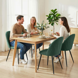 Set of 4 modern dining chairs with metal legs, shell back, and upholstered seat, green.