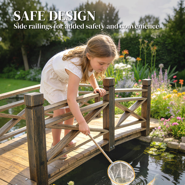 Charred wooden arch bridge with safety railings